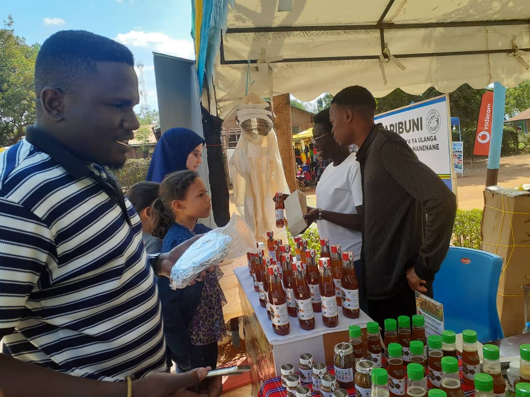Customer purchasing honey products.